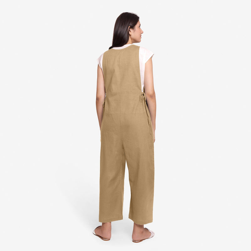 Back View of a Model wearing Beige Waist Tie Up Pinafore Jumpsuit