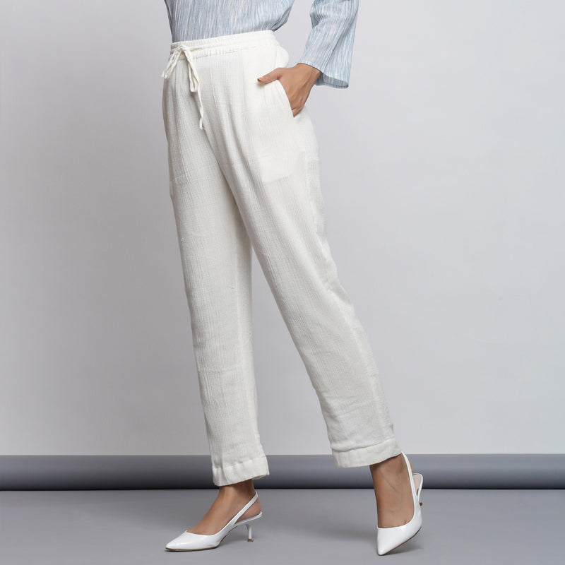Left View of a Model wearing Off-White Crinkled Cotton Tapered Pant