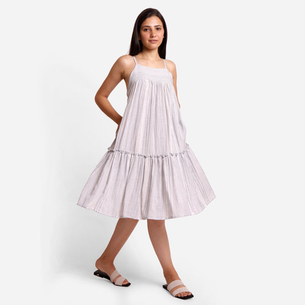 Right View of a Model wearing White Striped Cotton Knee Length Camisole Dress