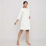 Front View of a Model wearing White Yoked Cotton Tunic Dress