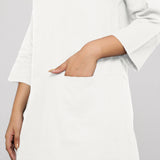 Front Detail of a Model wearing White Yoked Cotton Tunic Dress