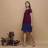 Left View of a Model wearing Wine and Navy Blue Handspun Cotton Paneled Boat Neck Shift Dress