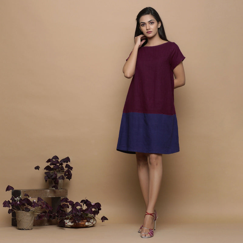 Front View of a Model wearing Wine and Navy Blue Handspun Cotton Paneled Boat Neck Shift Dress