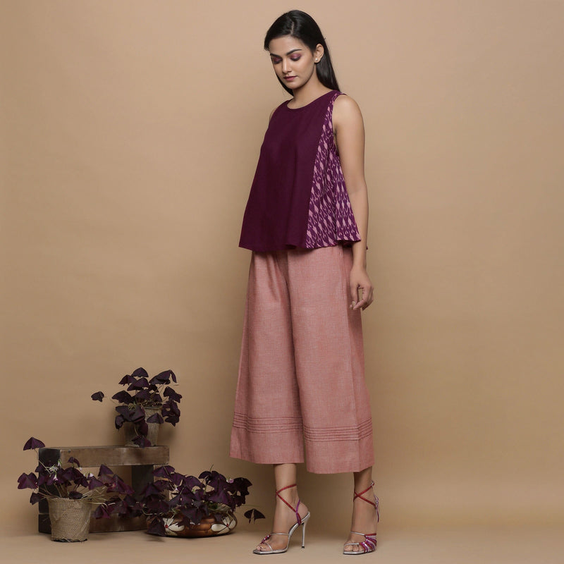 Left View of a Model wearing Wine Handwoven 100% Cotton Ikat Sleeveless Paneled Top