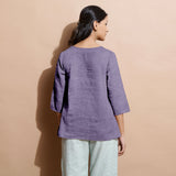 Back View of a Model wearing Wisteria 100% Linen Split-Neck Tunic Top