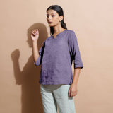 Left View of a Model wearing Wisteria 100% Linen Split-Neck Tunic Top