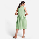 Back View of a Model wearing Yarn Dyed Cotton Green Yoke Dress
