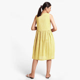 Back View of a Model wearing Yarn Dyed Cotton Lemon Yellow Yoke Dress