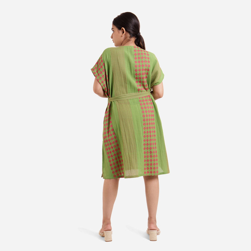 Back View of a Model wearing Green Crinkled Cotton Striped A-Line Dress