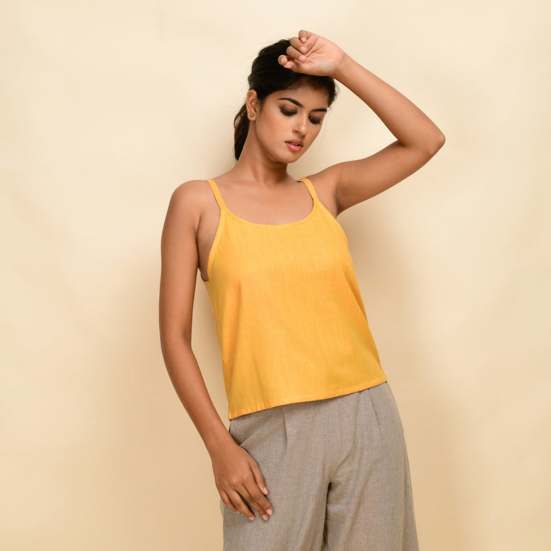 Front View of a Model wearing Yellow Yarn Dyed Handspun Cotton Round Neck Spaghetti Top