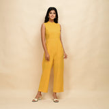 Front View of a Model wearing Yellow Cotton Khadi Sleeveless Jumpsuit