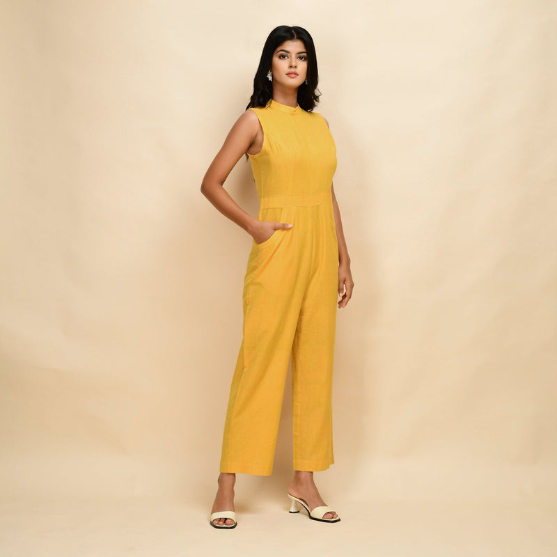 Right View of a Model wearing Yellow Cotton Khadi Sleeveless Jumpsuit