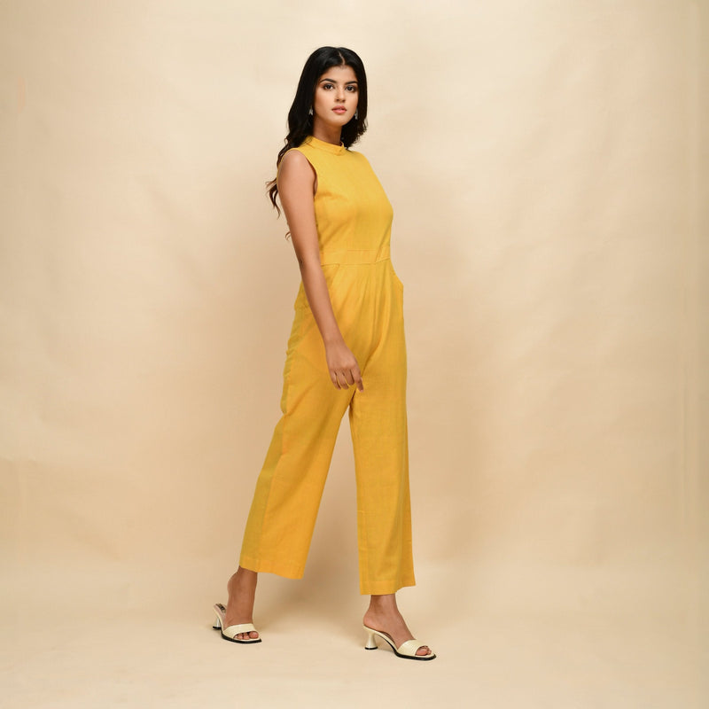 Right View of a Model wearing Yellow Cotton Khadi Sleeveless Jumpsuit