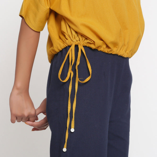 Right Detail of a Model wearing Solid Yellow Cotton Flax Blouson Top