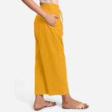 Back View of a Model wearing Yellow Cotton Flax Wide Legged Pant