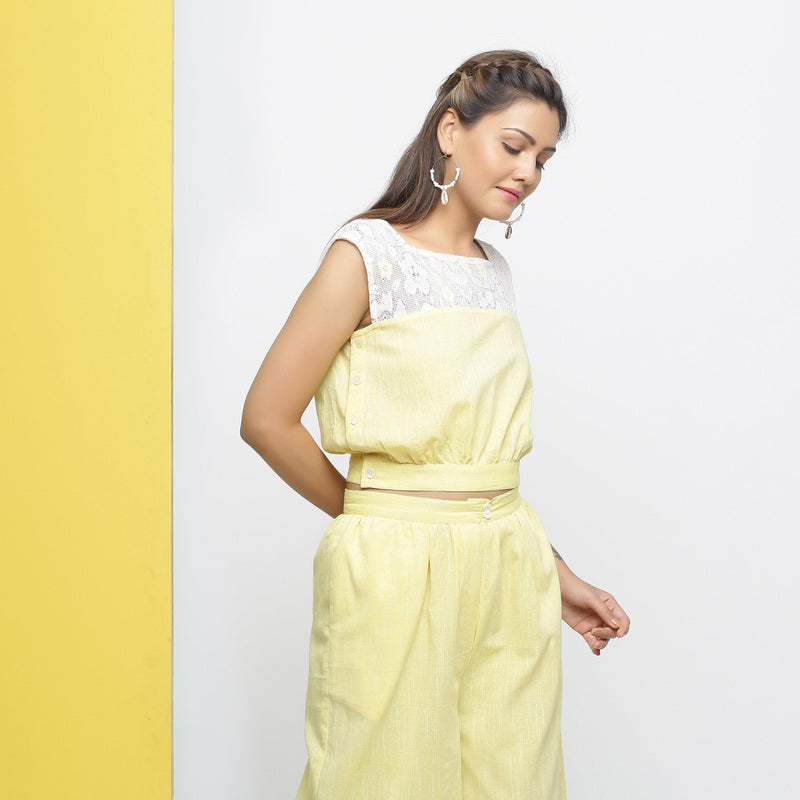 Right View of a Model wearing Yellow Cotton Lace Hand-Embroidered Crop Top