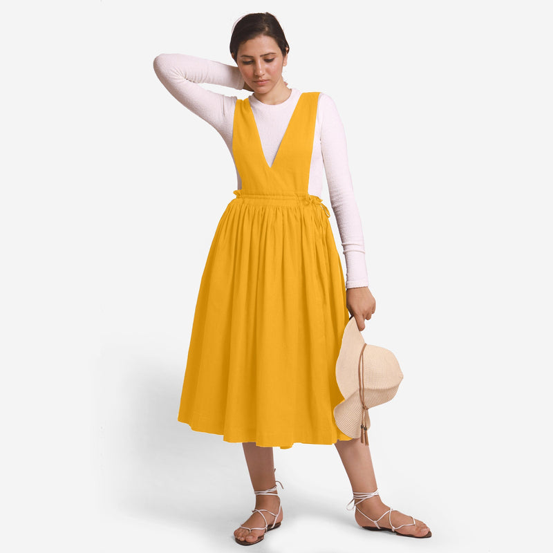 Front View of a Model wearing Yellow Deep Neck Pinafore Midi Wrap Dress