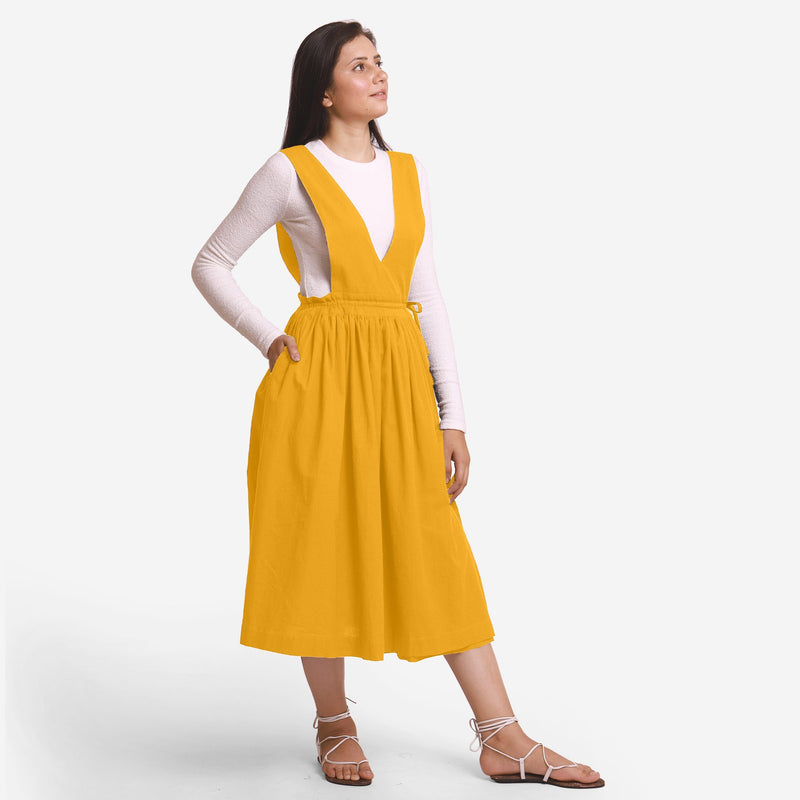 Right View of a Model wearing Yellow Deep Neck Pinafore Midi Wrap Dress