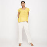 Front View of a Model wearing Yellow Hand Screen Printed 100% Cotton Top