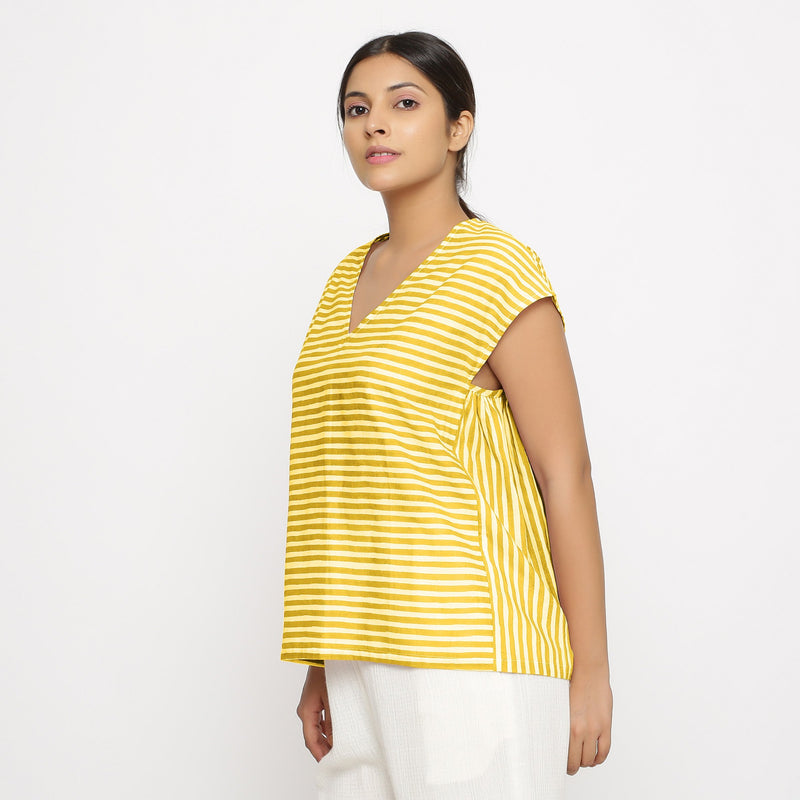 Left View of a Model wearing Yellow Hand Screen Printed 100% Cotton Top