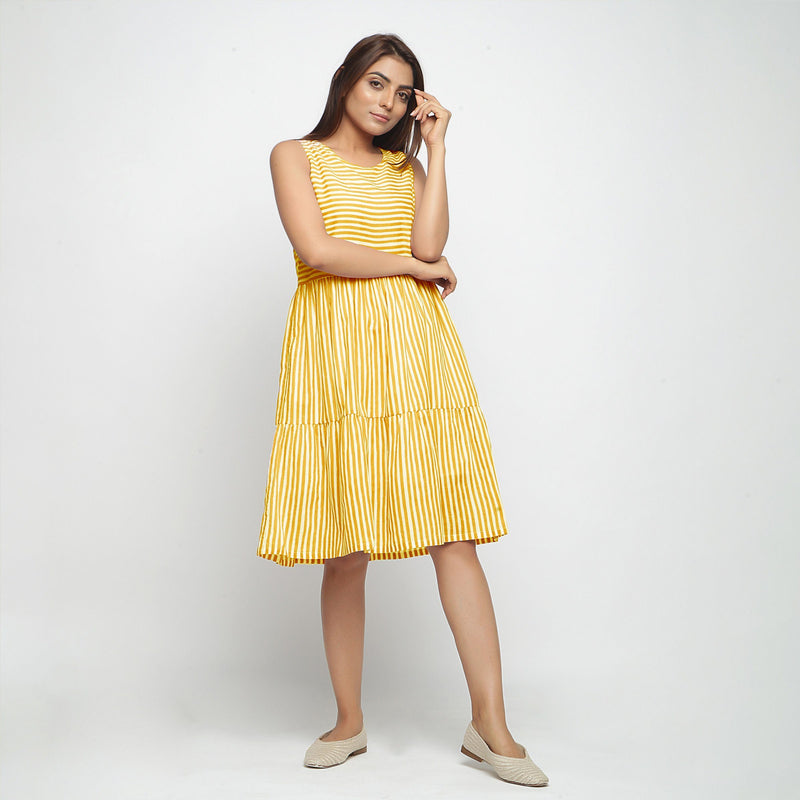Front View of a Model wearing Yellow Hand Screen Printed Lined Tiered Dress