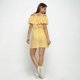 Back View of a Model wearing Yellow Hand-Screen Print Playsuit