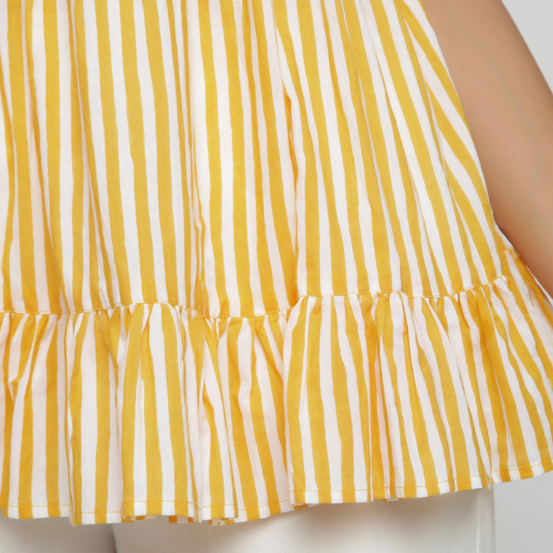Close View of a Model wearing Yellow Tiered Hand Screen Printed Top