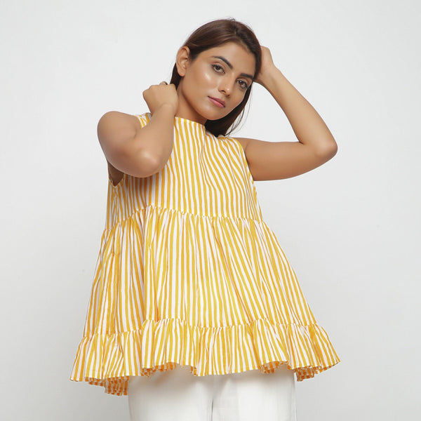 Right View of a Model wearing Yellow Tiered Hand Screen Printed Top
