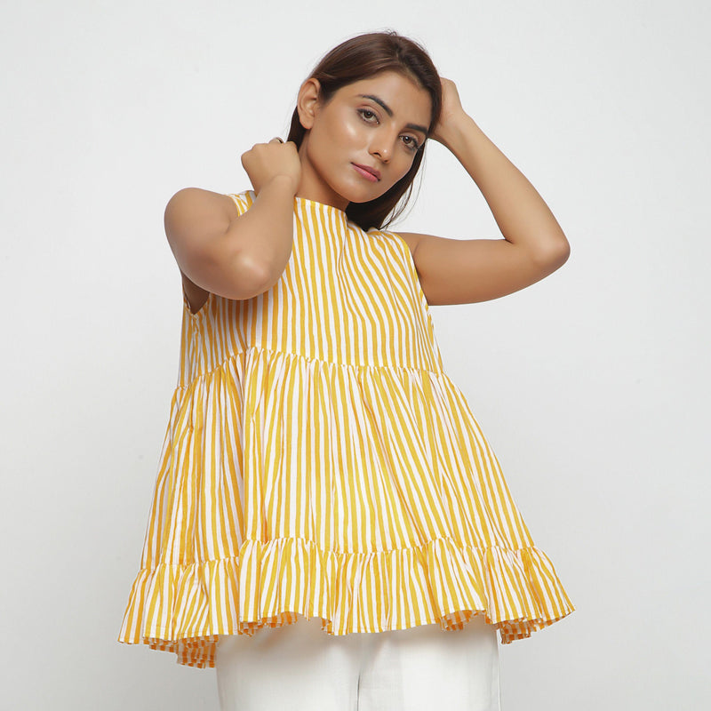 Right View of a Model wearing Yellow Tiered Hand Screen Printed Top