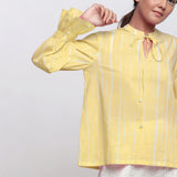 Front View of a Model wearing Yellow Hand Tie Dyed Shirred Blouson Top