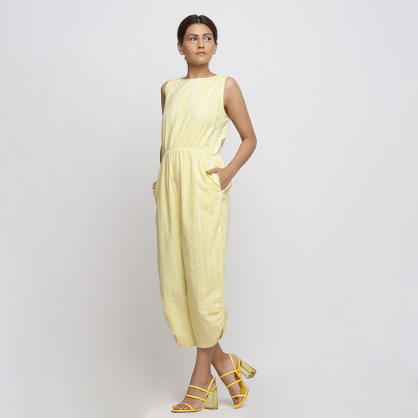 Left View of a Model wearing Yellow Hand Tie Dyed Straight Jumpsuit