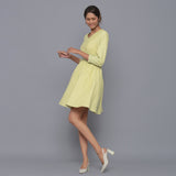 Left View of a Model wearing Yellow Pistachio V-Neck Corduroy Dress
