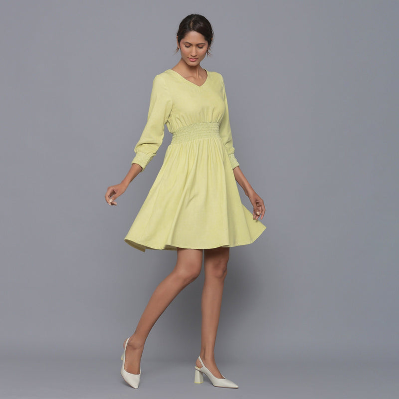 Right View of a Model wearing Yellow Pistachio V-Neck Corduroy Dress