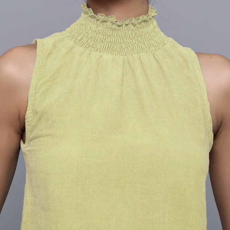 Front Detail of a Model wearing Yellow Pistachio Cotton Corduroy High Neck Top