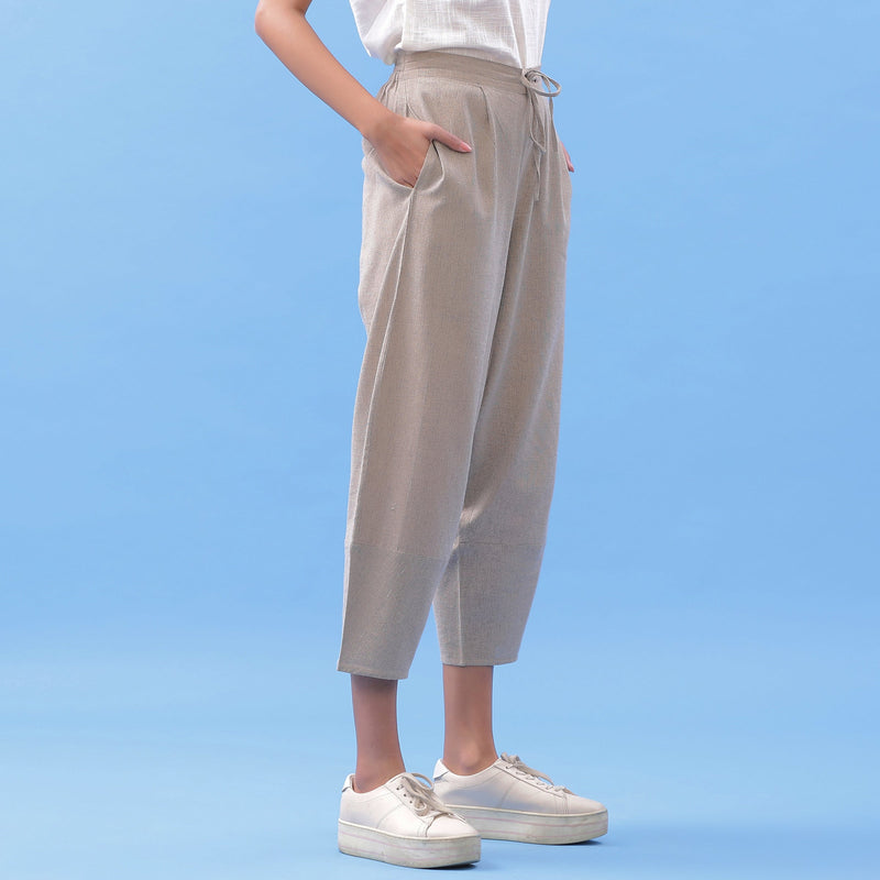 Right View of a Model wearing Essential Beige Cotton Paneled Pant