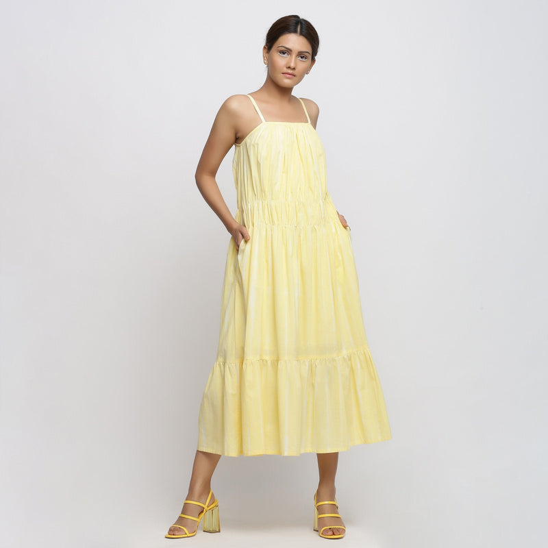 Front View of a Model wearing Yellow Hand Tie-Dye Cotton Midi Tiered Dress