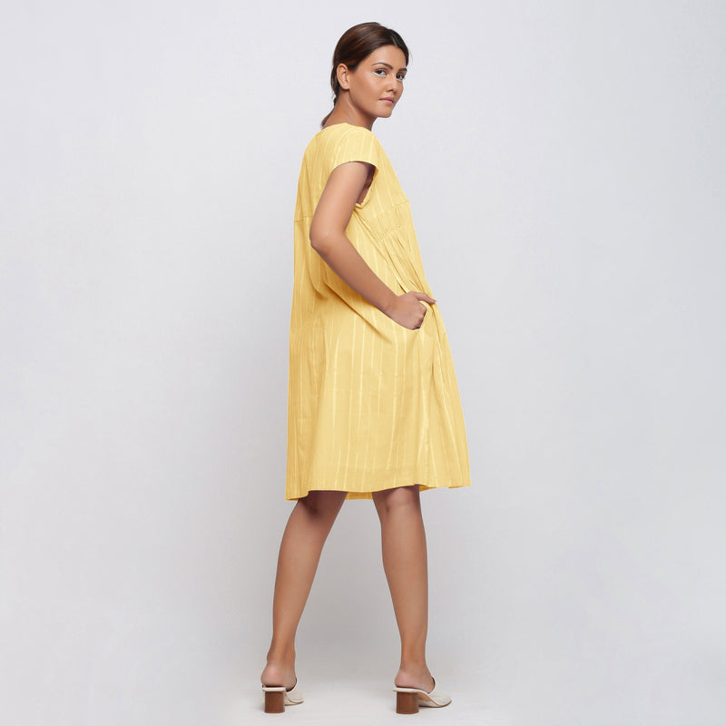 Back View of a Model wearing Yellow Tie Dye Yoked Knee Length Dress