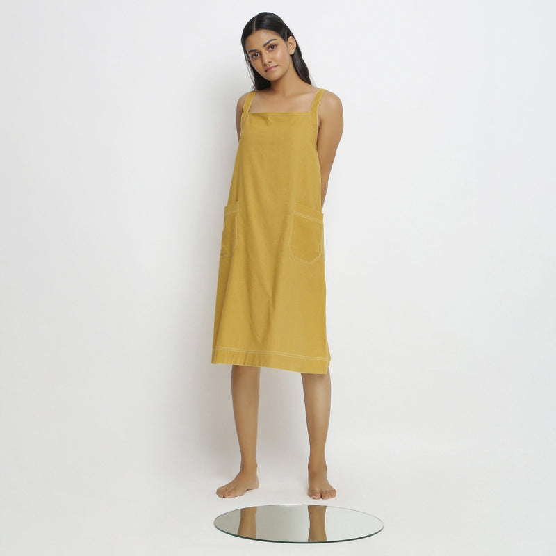 Front View of a Model wearing Yellow Vegetable Dyed Handspun Slip Dress