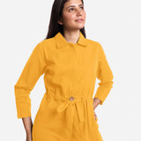 Front Detail of a Model wearing Yellow Wide Legged Cotton Overall