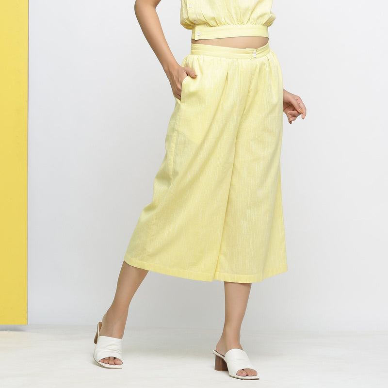 Right View of a Model wearing Light Yellow Yarn Dyed 100% Cotton Flared Culottes