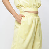 Right Detail of a Model wearing Light Yellow Yarn Dyed 100% Cotton Flared Culottes