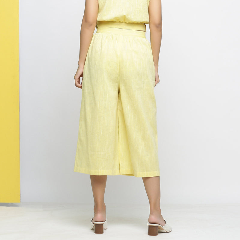 Back View of a Model wearing Light Yellow Yarn Dyed 100% Cotton Flared Culottes
