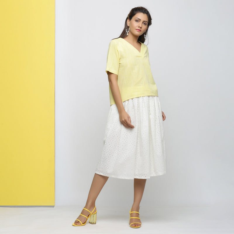 Right View of a Model wearing Yellow Yarn Dyed Cotton V-Neck High-Low Top